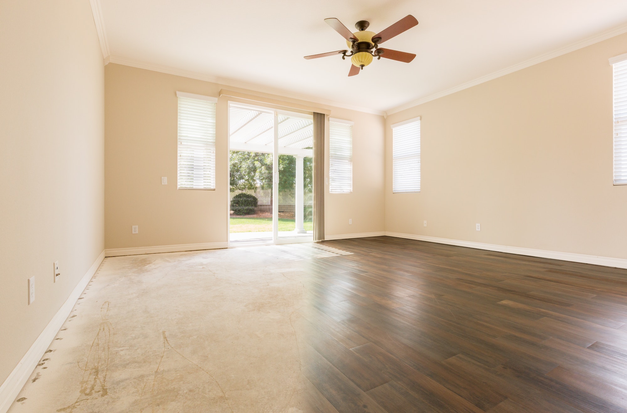 Room with Gradation from Cement Floors to Hardwood Flooring Installed.