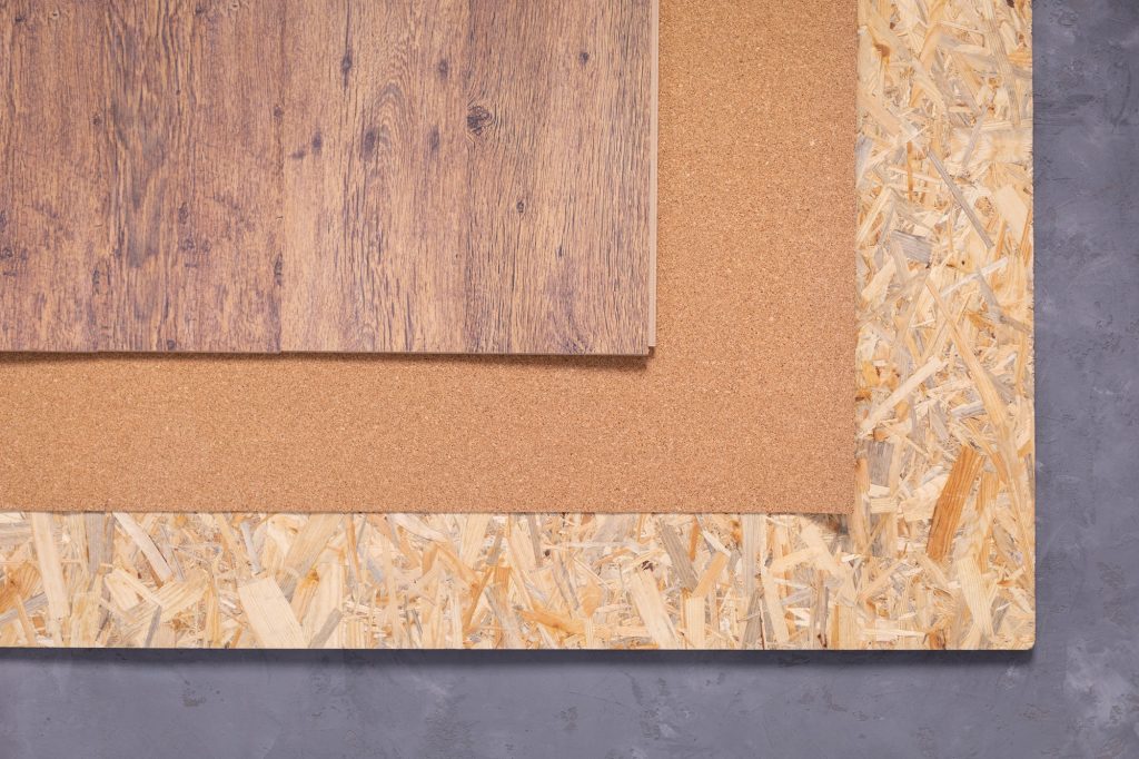 Laminate floor on wood osb background texture. Wooden laminate floor and chipboard